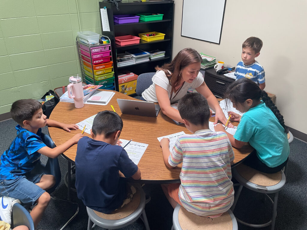 Thunder Valley K-8 students working with teacher 